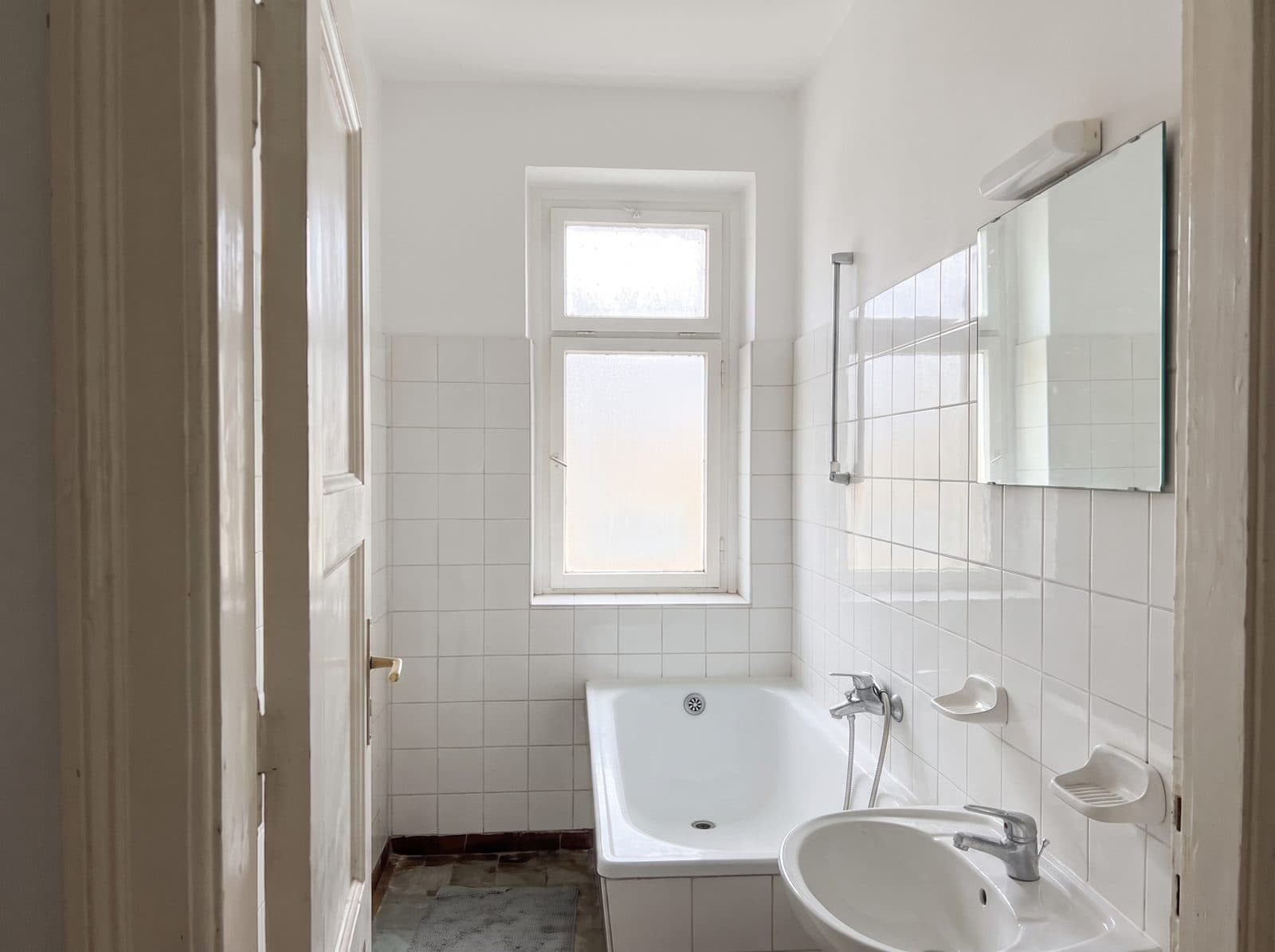 The same bathroom, cleaned and bright.