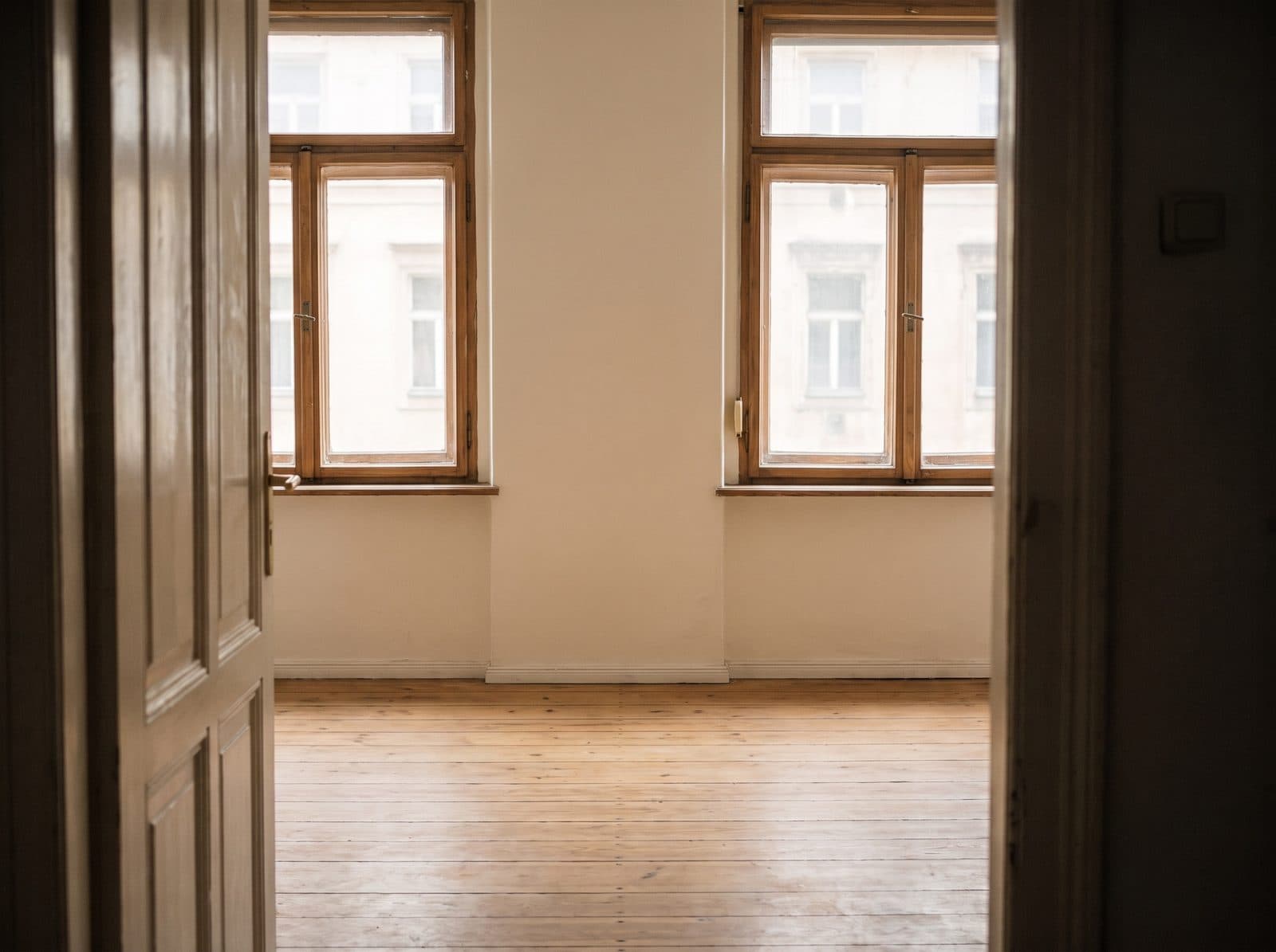 The same living room, empty, cleaned and lit.